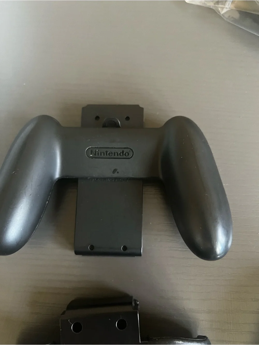 Nintendo Switch Joy-Con comfort grip and a black Joy-Con wrist strap. Used